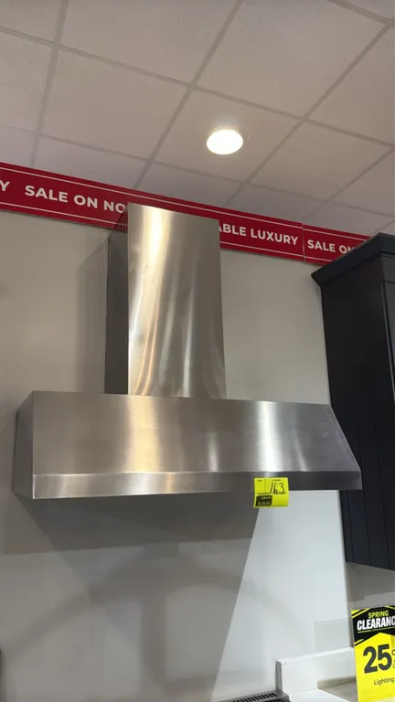 GE UVW8364SPSS wall-mount chimney range hood. Features stainless steel construction, push-button controls with boost mode, Chef Connect Wi-Fi connecti