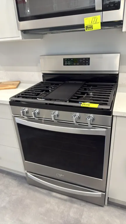 Whirlpool WFG775H0HZ2 freestanding gas range with convection oven. Features 5 gas burners, continuous cast iron grates, center griddle plate, digital