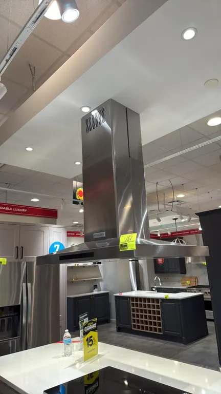 KitchenAid KVIB606DSS4 stainless steel island chimney range hood. Features integrated underside lighting, mesh filter panels, and electronic push-butt