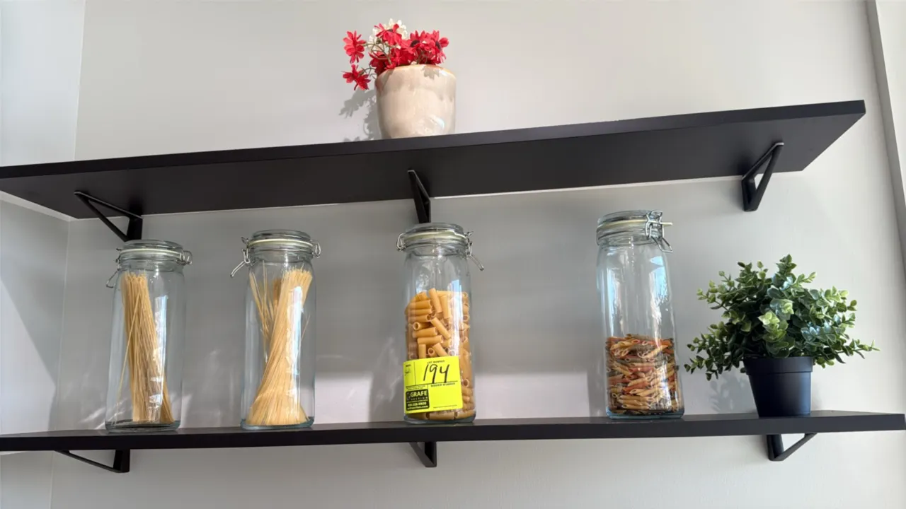 Assorted decorative kitchen and display smallwares. Includes (4) wire-bail glass jars, wood paddle cutting board, round wooden display board, ceramic