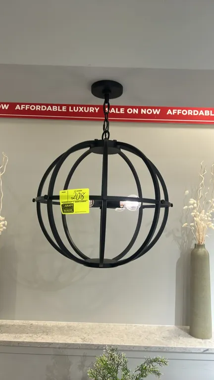 Circular metal orb chandelier. Features a matte black metal open-cage spherical design, multi-light central socket cluster, hanging chain, and ceiling