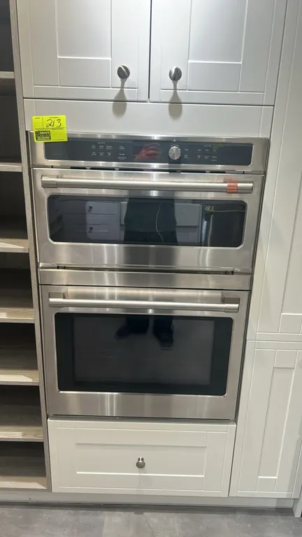 Café CTC912P2N1S1 combination double wall oven. Features stainless steel finish, upper oven with Advantium speedcook technology, lower convection oven