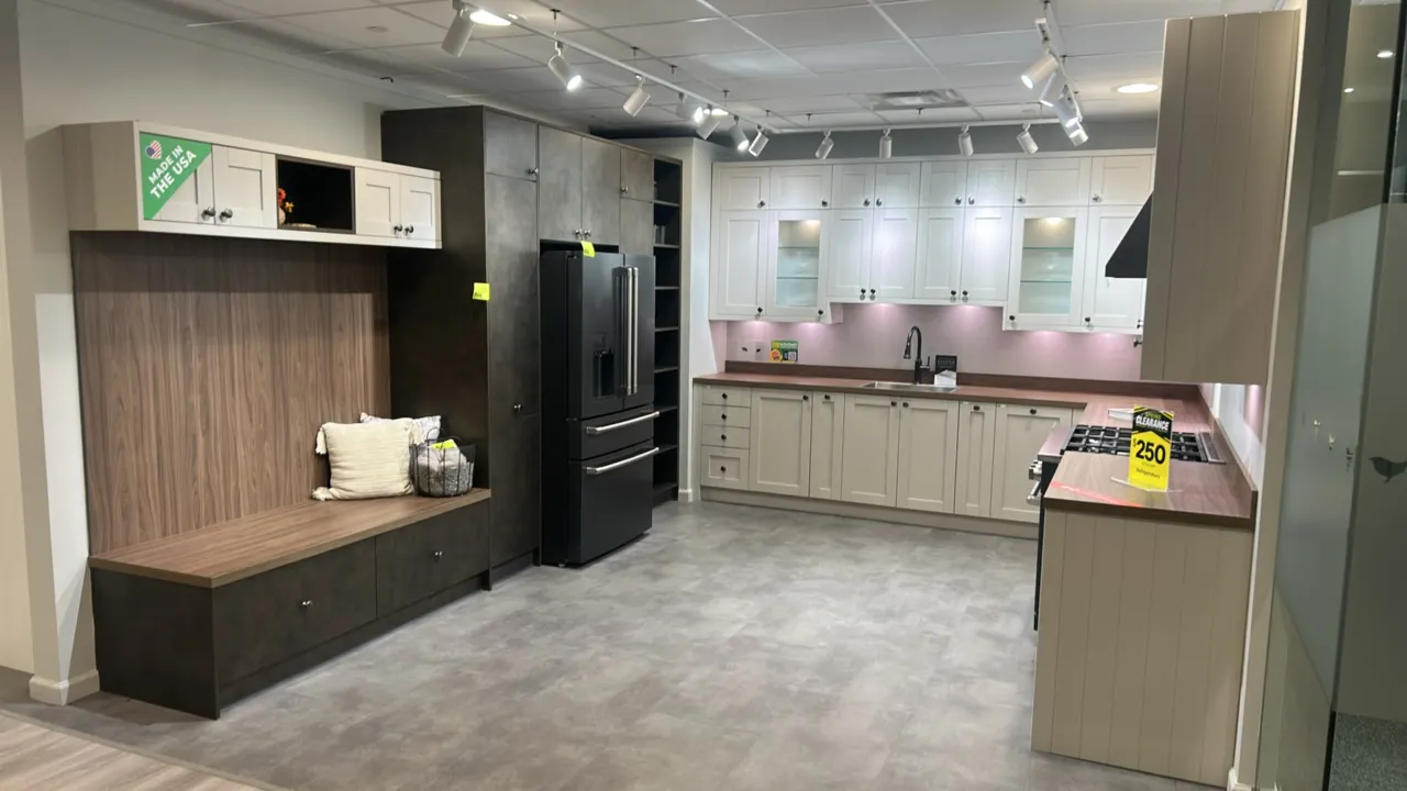 Infinity Plus laminate kitchen cabinet set. Features laminate countertops, upper and lower cabinets, pantry tower, bench seat with storage, and built-