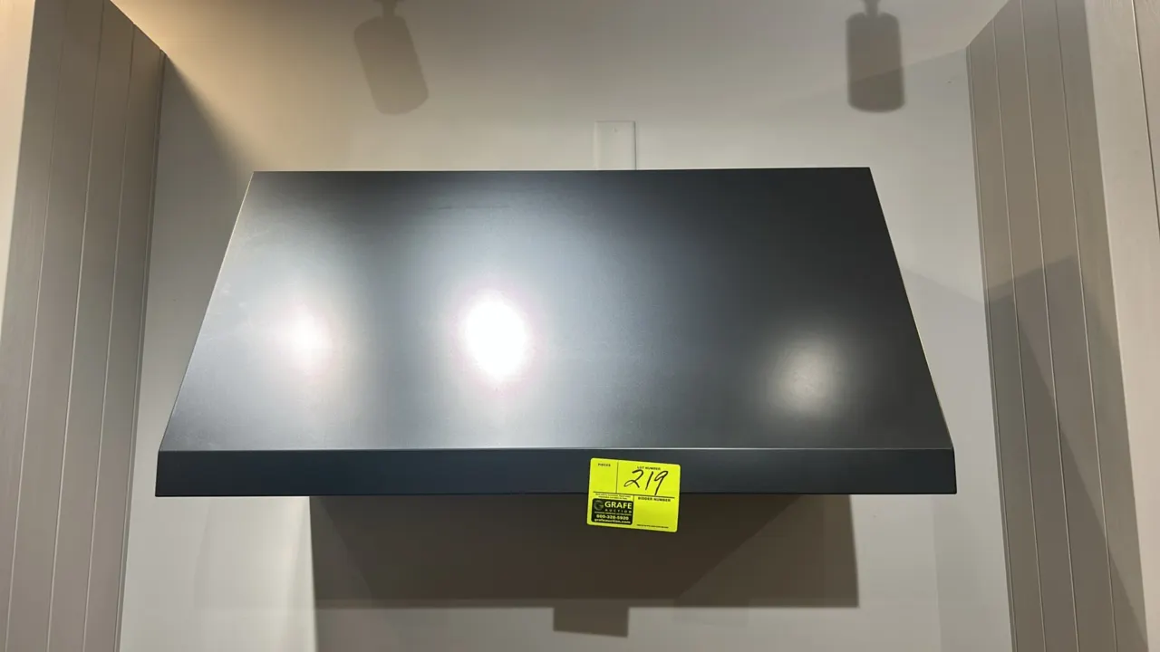 Café 36" range hood. Features a matte dark metal finish, stainless steel baffle filters, push-button controls with multi-speed fan settings, and dual