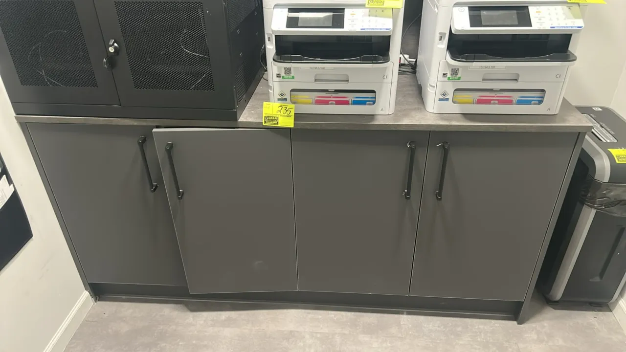 Infinity Plus laminate storage base cabinet with laminate countertop. Features a 4-door design with dark gray finish and black bar pull handles. 74" x
