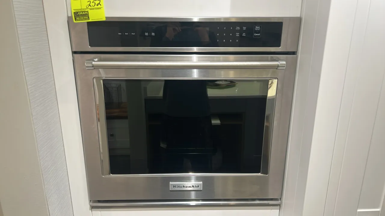 KitchenAid KOST100ESS04 built-in electric single wall oven. Features stainless steel finish, digital touch controls, large glass viewing window, and b