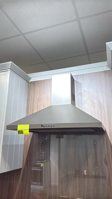 GE JVW5301EJ2ES wall-mount range hood. Features slate finish, electronic push-button controls with boost mode, dual halogen cooktop lighting, and remo