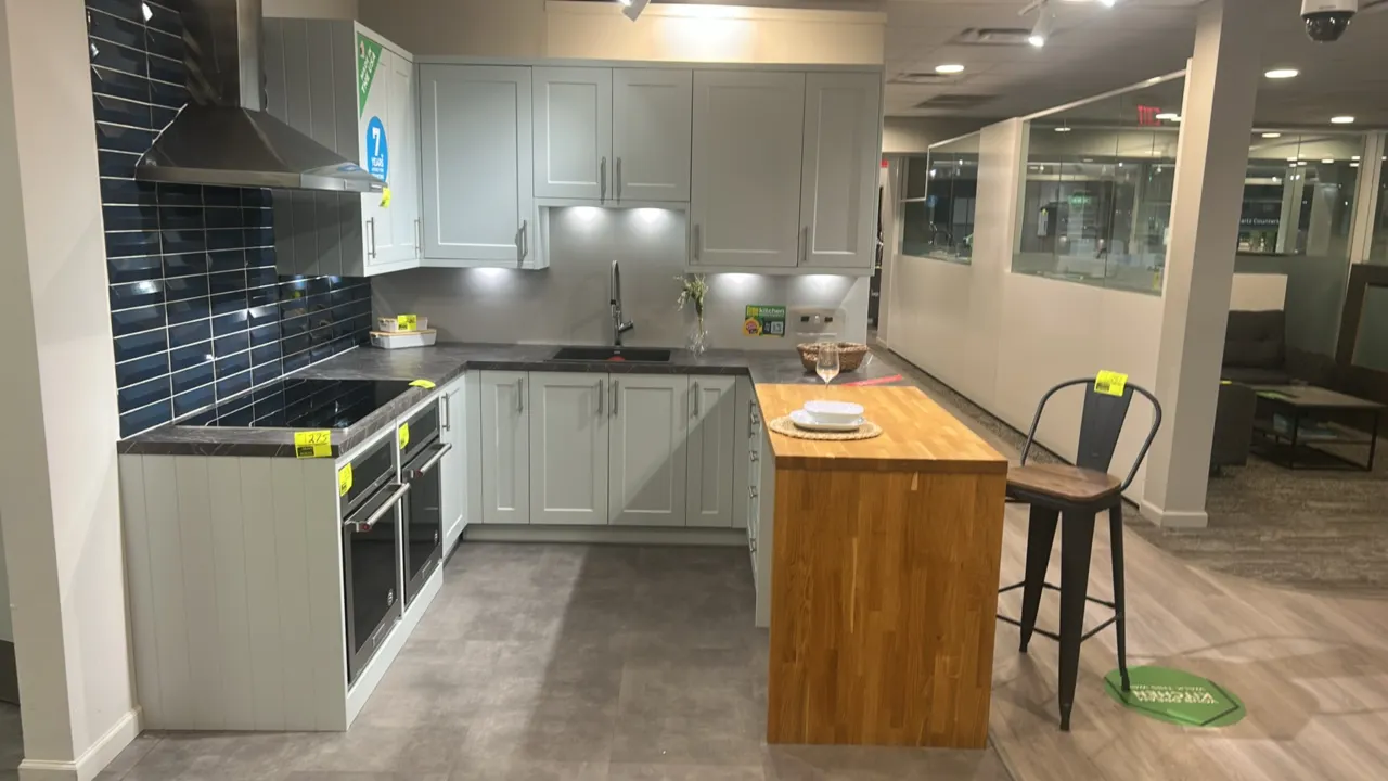 Infinity Plus laminate kitchen cabinets. Includes laminate and butcher block countertops, Blanco sink, and stainless steel faucet. 96" x 104" x 92". N