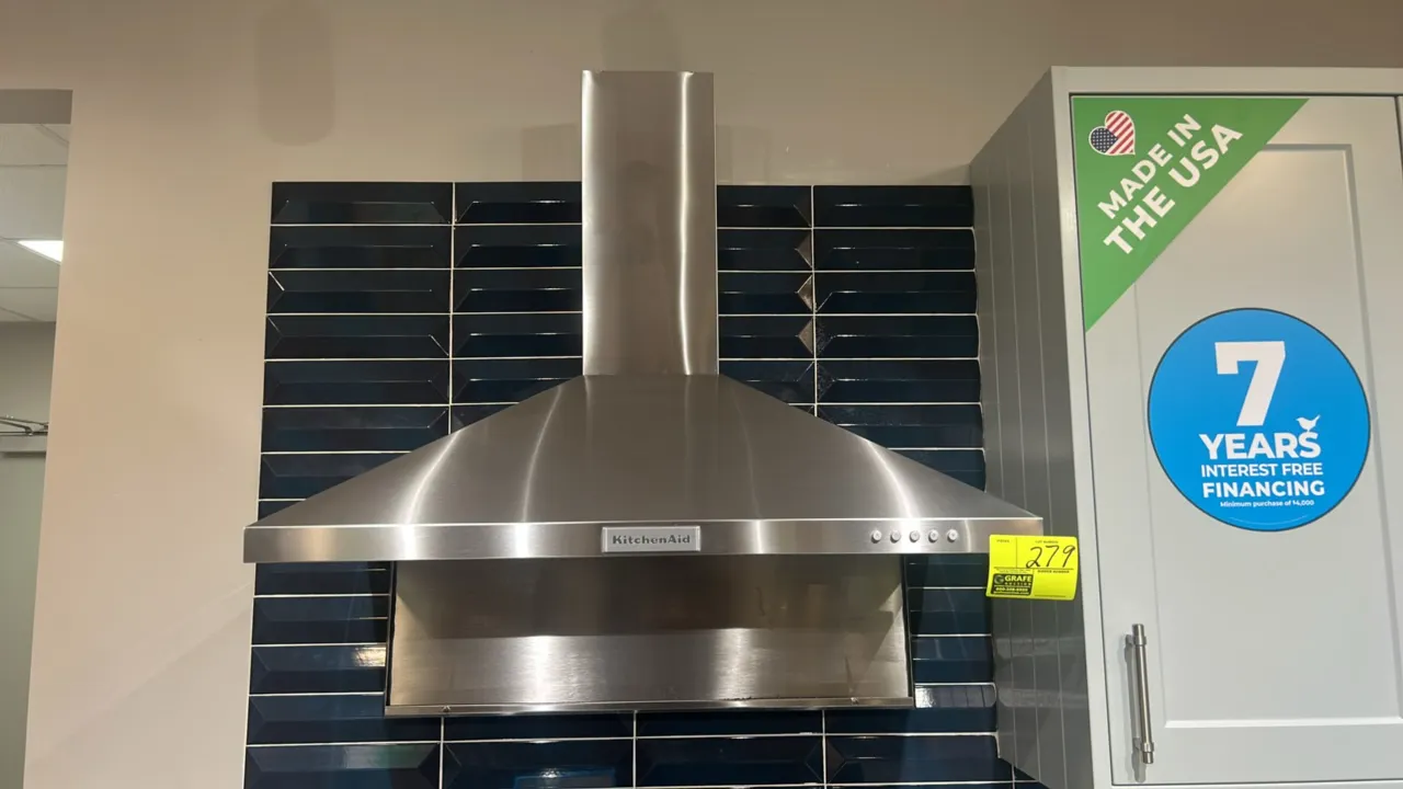 KitchenAid KVWB406DSS4 36" wall-mount canopy range hood. Features stainless steel construction, 3-speed push-button blower controls, and dual cooktop
