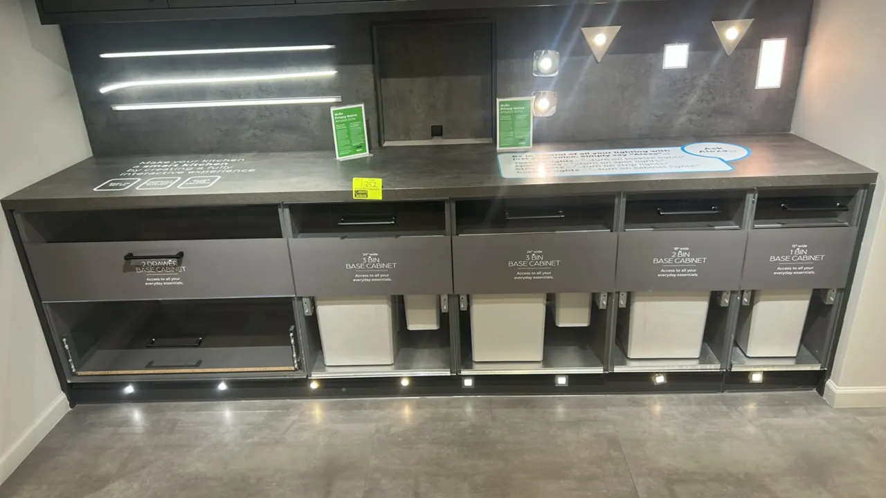 Wren Kitchens Infinity Plus laminate kitchen cabinets. Includes upper wall cabinets with poly doors, base cabinets with drawer and pull-out bins, lami