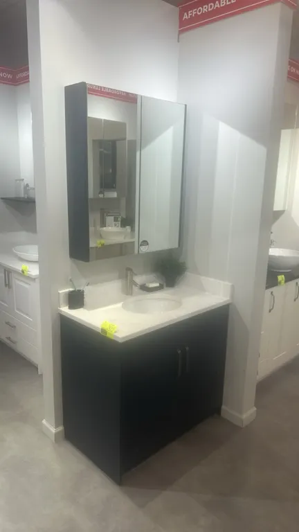 Infinity Plus bathroom vanity cabinet set. Features 2-door lower laminate vanity cabinet, solid surface countertop with undermount sink, single-handle