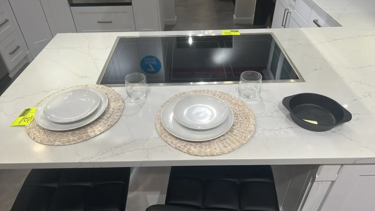 Assorted kitchen smallwares and tableware. Includes (2) glass storage canisters with lids, (2) wood cutting boards, (1) embossed ceramic bowl, (1) spe
