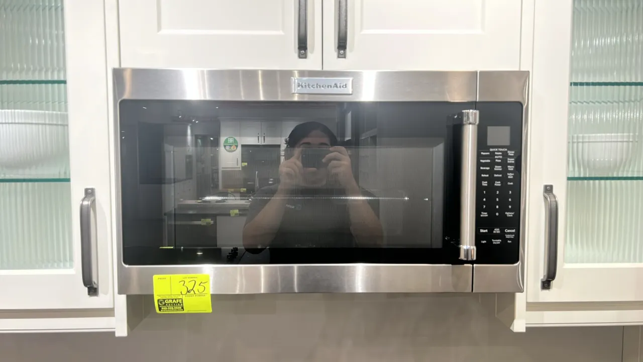 2021 KitchenAid KMHS120ESS11 over-the-range microwave oven. Features stainless steel exterior, digital touch controls, interior wire cooking rack, and