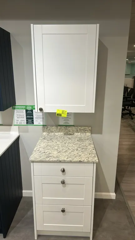 Infinity Plus laminate cabinet set with quartz countertop. Includes upper single-door wall cabinet and 3-drawer base cabinet. Features white shaker-st