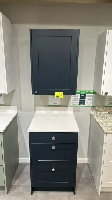 Infinity Plus Shaker Chelsea laminate cabinet set with quartz countertop. Includes single-door wall cabinet and 3-drawer base cabinet. Features Navy B