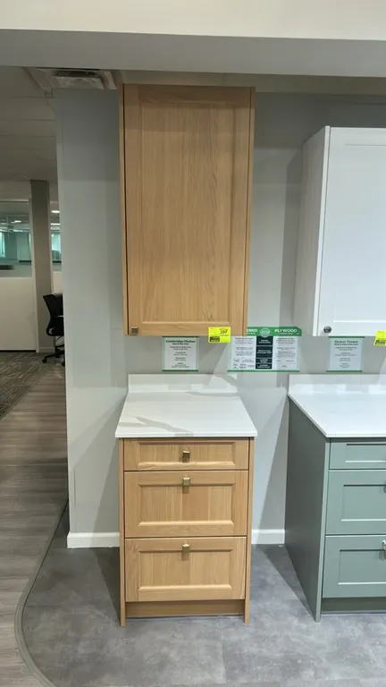 Infinity Plus Cambridge Timber laminate cabinet set with quartz countertop. Includes single-door upper wall cabinet and 3-drawer base cabinet. Feature