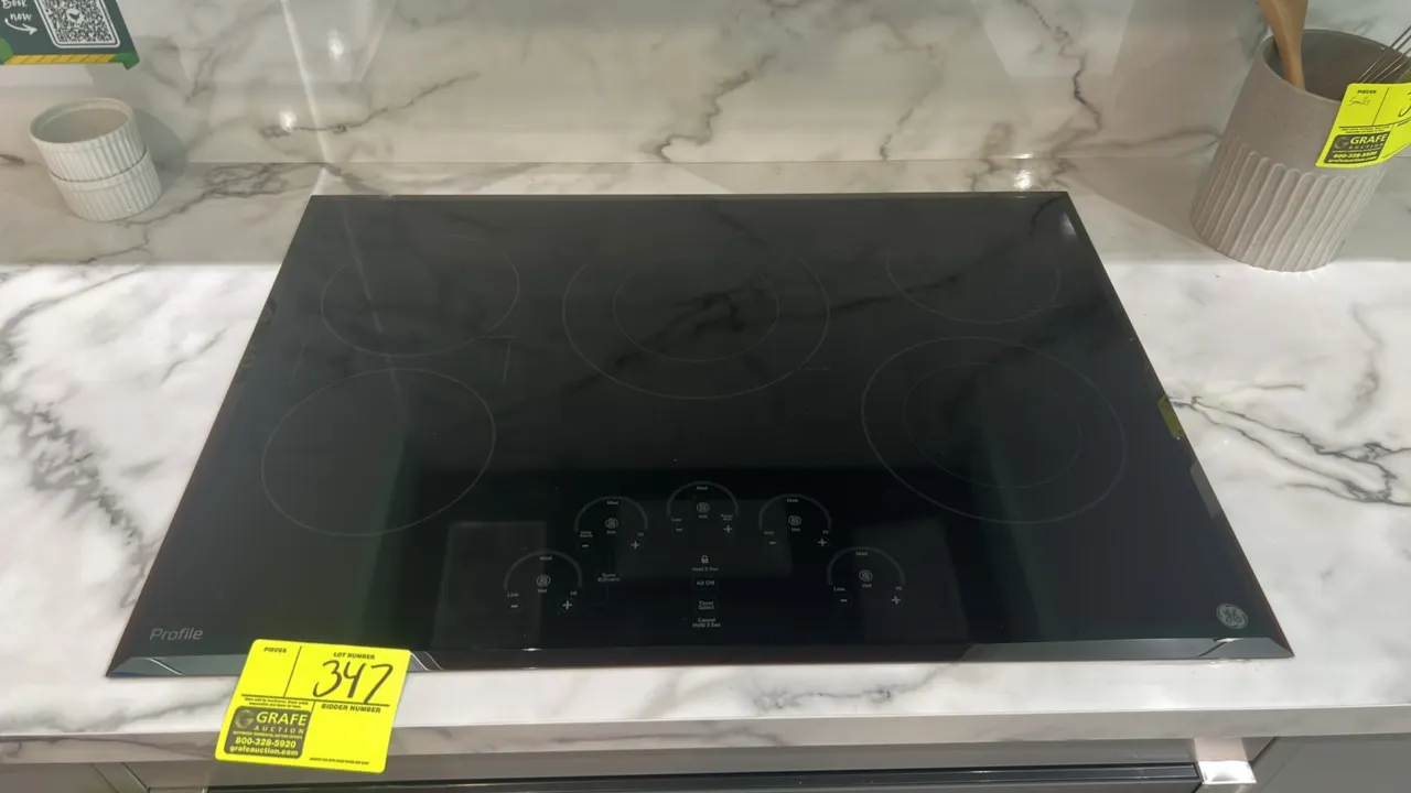 GE Profile PP9030DJ2BB built-in electric cooktop. Features 5 radiant elements, digital touch controls, Sync burners capability, and Power Boil element