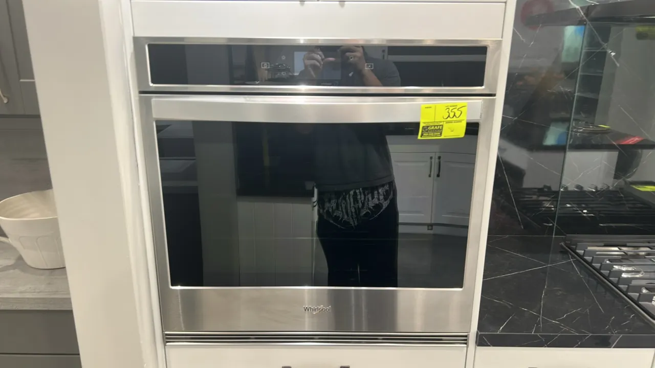 Whirlpool WOS72EC0HS20 built-in single electric wall oven. Features stainless steel finish, digital touch display, interior racks, and convection fan.