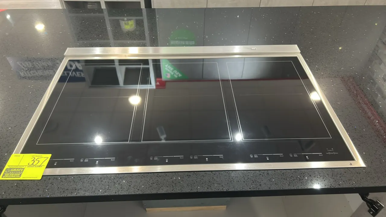 Whirlpool JIC4736HS electric cooktop. Features 6-zone smooth ceramic glass surface, digital touch controls, and stainless steel trim. S/N: XD92601268.