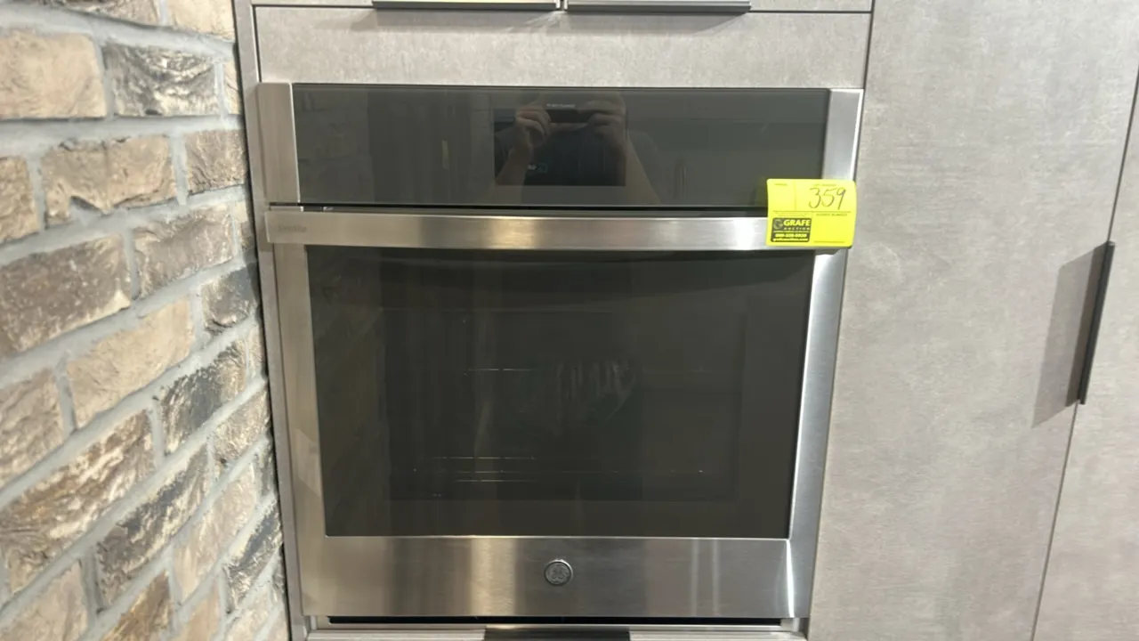 GE Profile PKS7000SN2SS smart built-in convection single wall oven. Features stainless steel finish, glass viewing window, touchscreen display, and (2