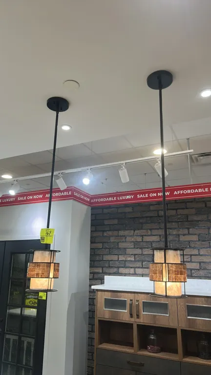 Quoizel Laguna 1-light mini pendant lights. Features a Renaissance Copper finish, faux mica inner shade with decorative mosaic tile band, metal cage f