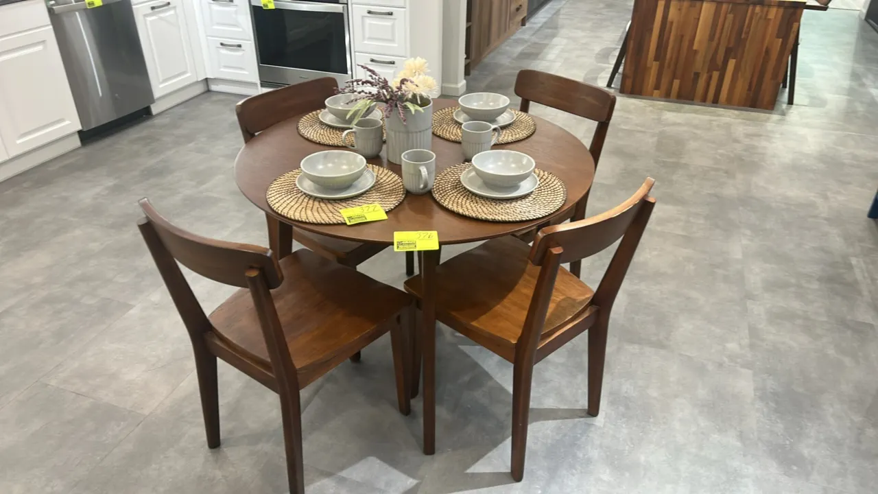 Wooden dining set. Includes 42" circular dining table and (4) matching wooden dining chairs. Features mid-century modern styling with tapered legs, cu