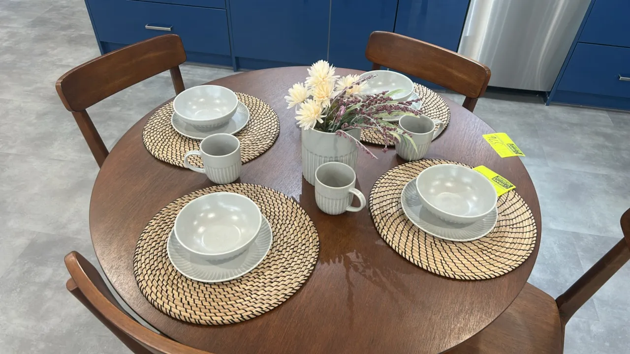 Assorted tabletop smallwares. Features light gray fluted ceramic design. Includes (4) round woven placemats, (4) ceramic bowls, (4) ceramic plates, (4