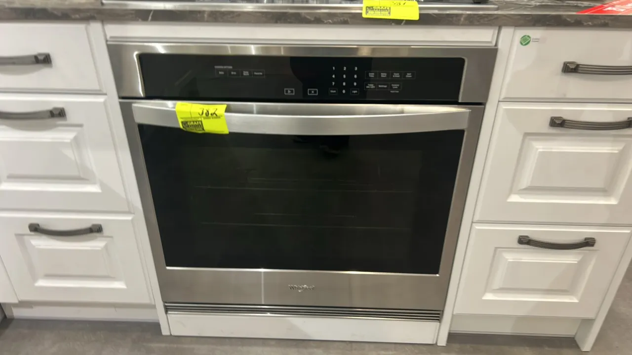 Whirlpool WOS31ES0JS20 built-in single electric wall oven. Features stainless steel finish, digital touchpad controls, glass viewing window, towel bar