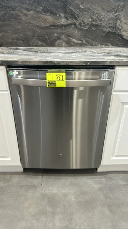 GE GDT645SYN5FS built-in dishwasher. Features stainless steel exterior and interior tub, bar handle, top controls, and two dish racks with silverware