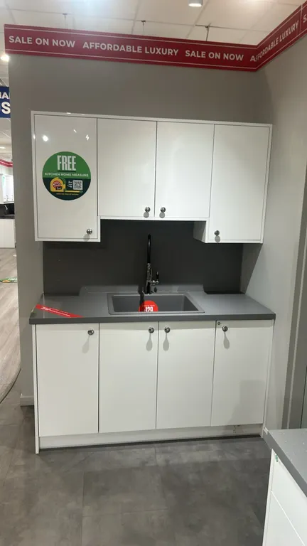 Infinity Plus laminate kitchen cabinets. Features laminate countertops, 62" x 84" section with Blanco sink and pull-down faucet, and 139" x 84" sectio