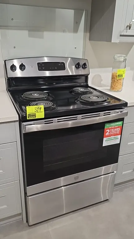 GE JBS360RM2SS 30" electric range. Features stainless steel finish, 4-burner coil cooktop, digital control panel, oven with glass viewing window, two