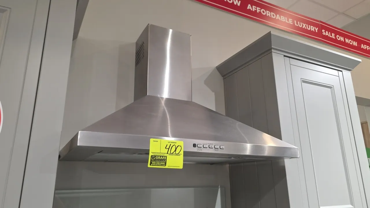 GE JVW5301SJ1SS stainless steel range hood vent. Features push-button controls with 3-speed fan and boost mode, integrated cooktop lighting, removable