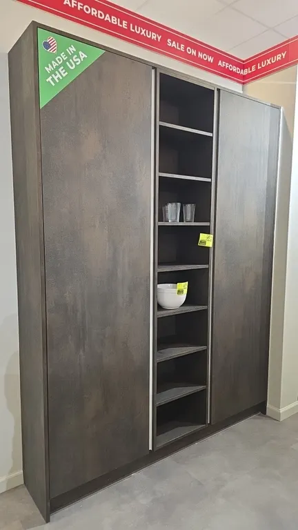 Infinity Plus pantry wall cabinet and L-shaped office suite. Includes 72" x 91" pantry wall cabinet with (2) side doors and open center shelving, and