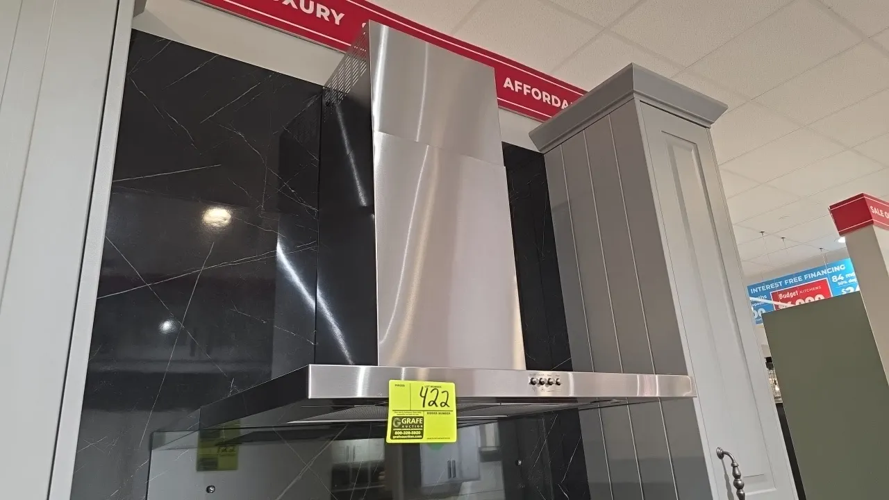 Whirlpool WVW57UC0FS3 stainless steel range hood vent. Features push-button controls, mesh grease filters, built-in lighting, and telescoping chimney