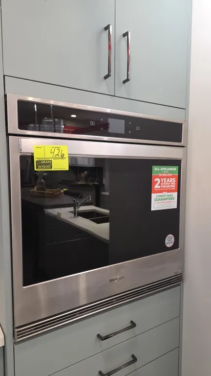 Whirlpool WOS51EC0HS20 built-in single wall oven. Features stainless steel trim, black glass front door, digital touchscreen control panel, and (2) in
