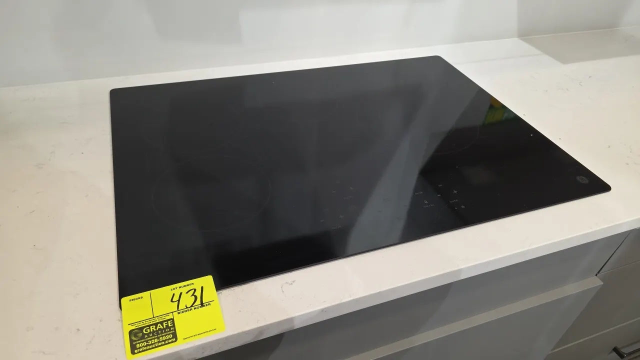 GE JP5030DJ2BB built-in electric cooktop. Features black ceramic glass surface, 4 radiant heating elements, synchronized burner controls, and digital