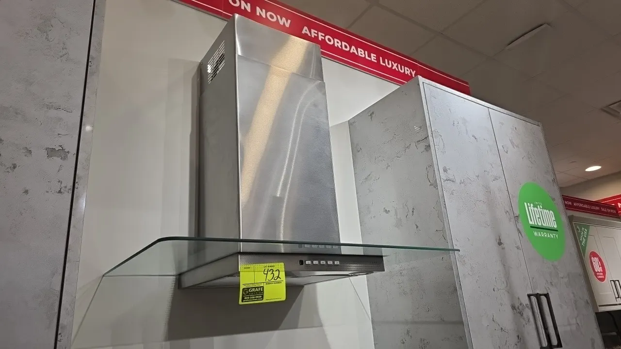 Café CVW73012M1SS stainless steel range hood vent. Features curved glass canopy, multi-speed push-button blower controls, and integrated lighting. S/N