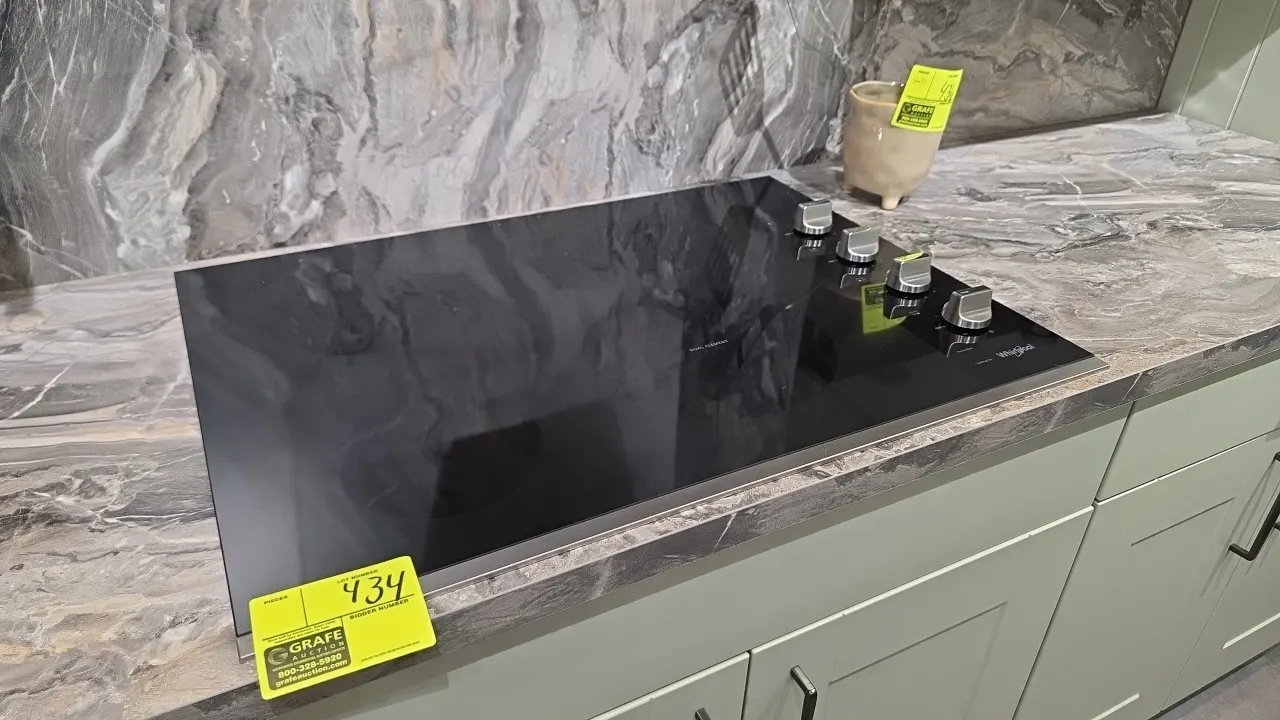 Whirlpool WCE55US0HS01 30" built-in electric glass cooktop. Features 4 radiant cooking elements including a dual element, right-side knob controls, an