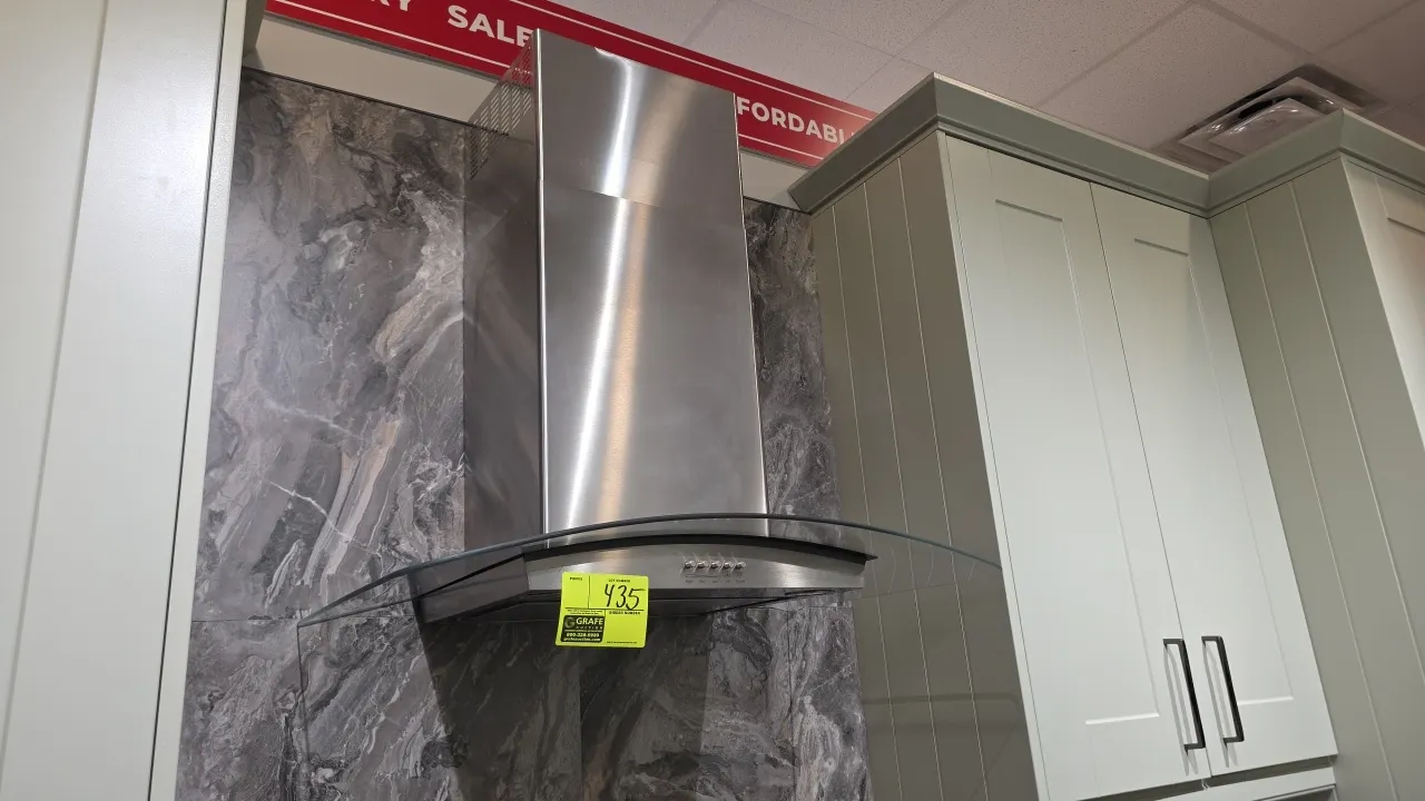 Whirlpool WVW75UC0DS4 stainless steel range hood. Features curved glass canopy, 3-speed fan push-button controls, integrated lighting, and stainless s