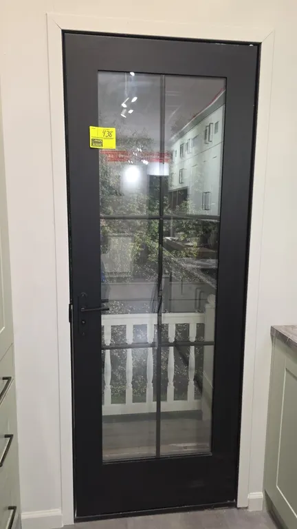 Metal 6-lite glass panel door. Features a dark gray finish, 6 glass panes, and includes matching lever handle and deadbolt hardware. 29"W x 80"H. Note