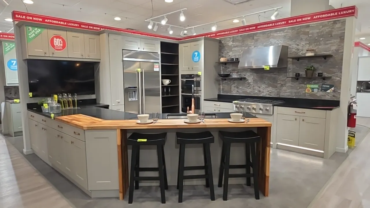 Infinity Plus V-shape peninsula and L-shape kitchen cabinet set. Features upper and lower cabinets, quartz countertops, 40" x 88" x 36"H waterfall but