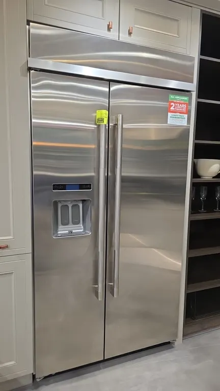2022 JennAir JS42PPDUDE01 built-in side-by-side refrigerator/freezer. Features stainless steel exterior, knurled pro-style handles, exterior ice and w