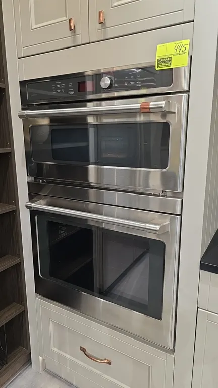 2022 Café CTC912P2N1S1 30" built-in microwave and oven combination. Features stainless steel finish, upper microwave with turntable and wire rack, low