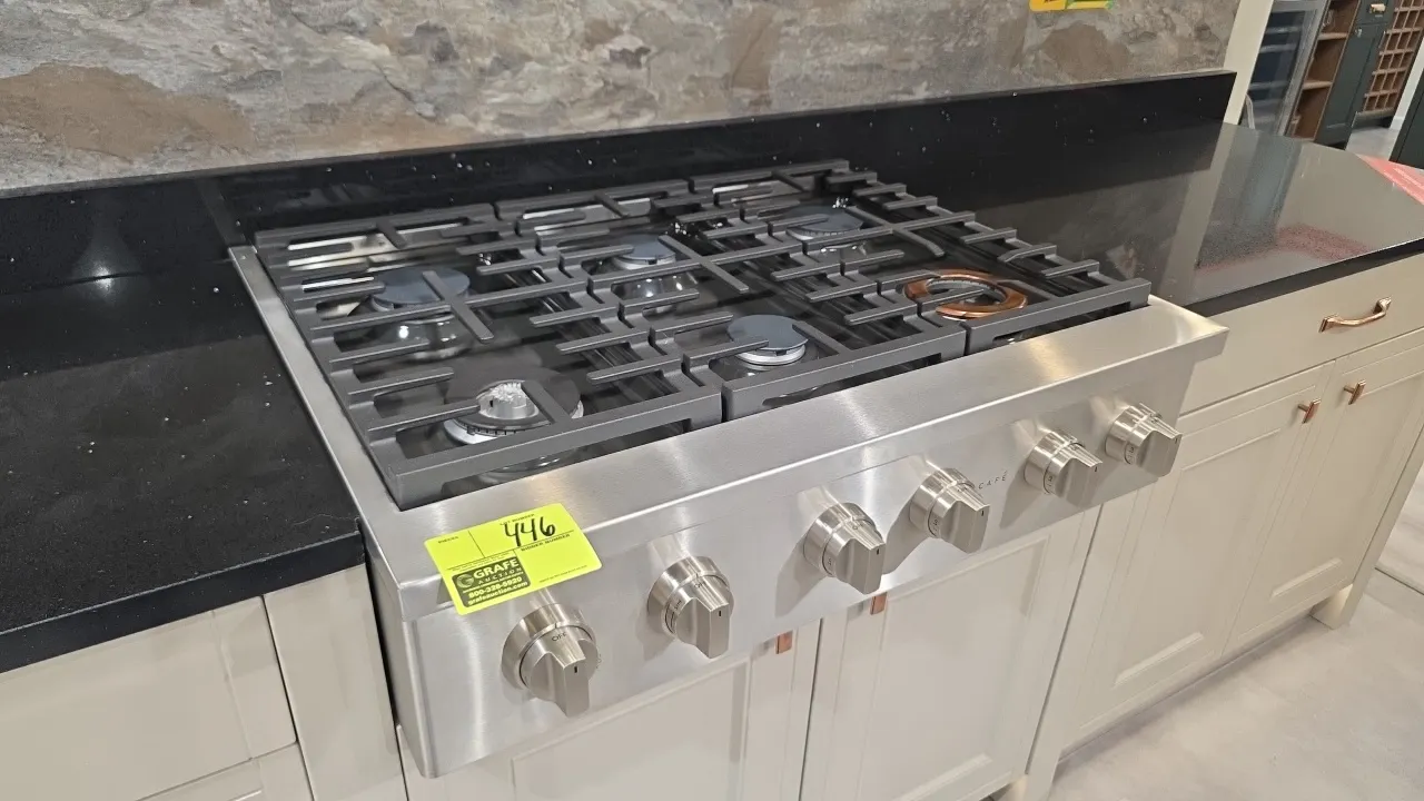 Café CGU366P2T1S1 36" 6-burner natural gas rangetop. Features stainless steel construction, continuous cast iron grates, and front control knobs. S/N: