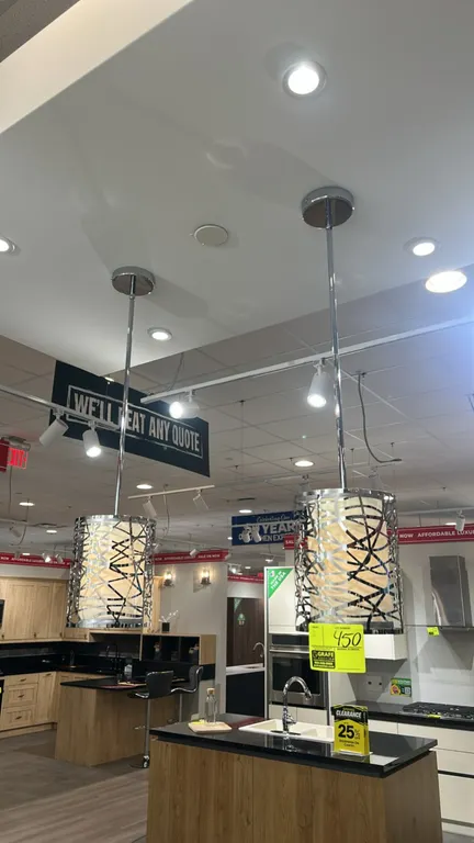Quoizel Abode 8" mini pendant lights. Features polished chrome finish, geometric patterned metal outer cage shade, inner cylindrical shade diffuser, r