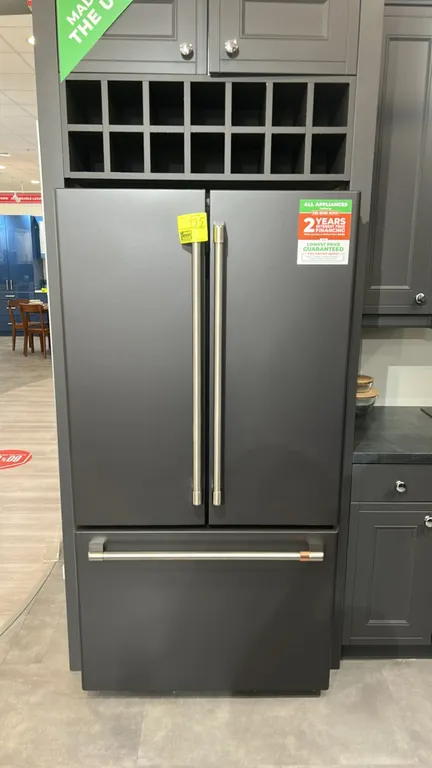 Café CWE23SP3MJD1 French door refrigerator with bottom freezer drawer. Features interior lighting, adjustable glass shelving, crisper drawers, door st