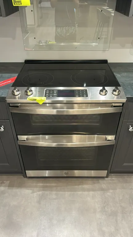 GE JSS86SP5SS slide-in electric convection double oven range. Features stainless steel finish, 5-element smooth glass cooktop, lower convection oven,