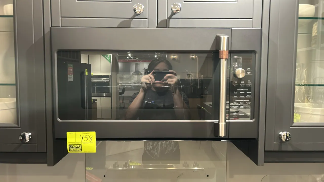 2021 Café CVM517P3M6D1 convection over-the-range microwave oven. Features stainless steel interior cavity, glass turntable, interior wire rack, round