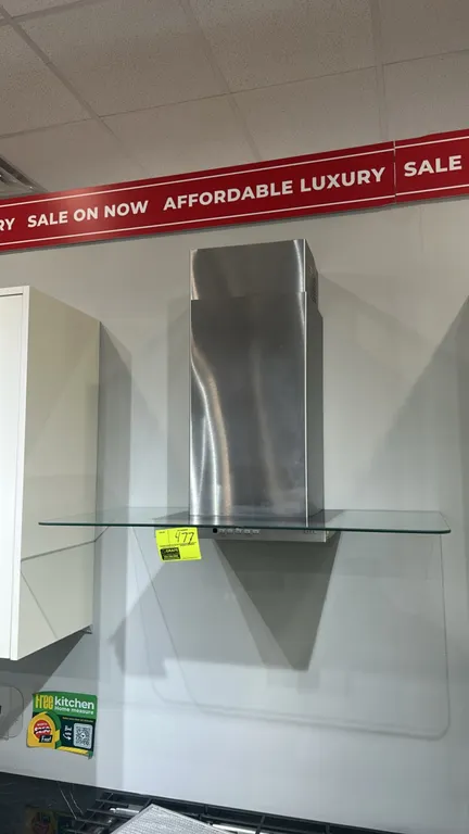 GE Café CVW73612M1SS over-range hood. Features stainless steel chimney, glass canopy, push-button controls, and integrated lighting. S/N: SS812397S. E