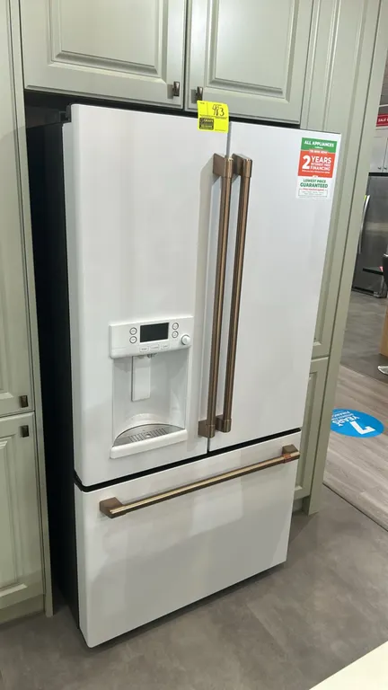 Café CFE28TP4MJW2 French-door refrigerator with bottom freezer drawer. Features exterior water dispenser with hot water function, ice dispenser, adjus
